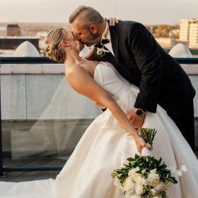 Bride and groom sharing a kiss in downtown Grand Rapids, MI