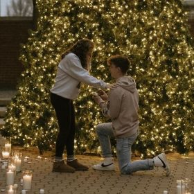 downtown-holland-christmas-tree-engagement.jpg Holiday proposal in front of the lit Christmas tree in downtown Holland