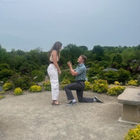 Proposal photo in Frederik Meijer Gardens surrounded by spring blooms.